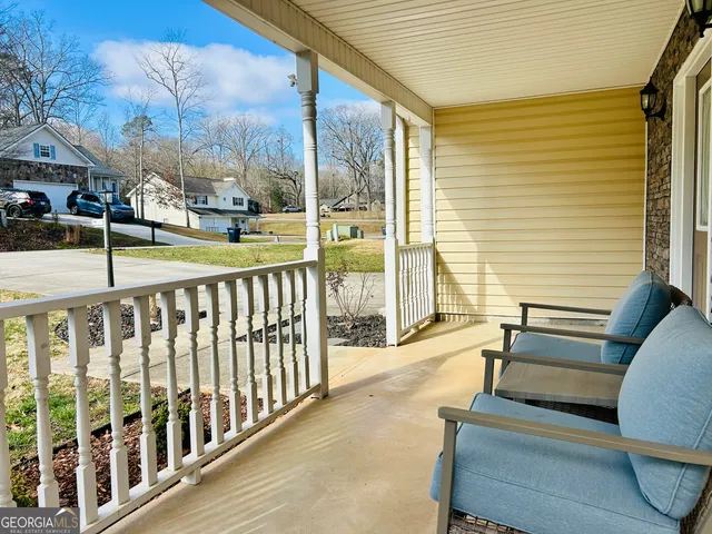 a view of balcony with furniture