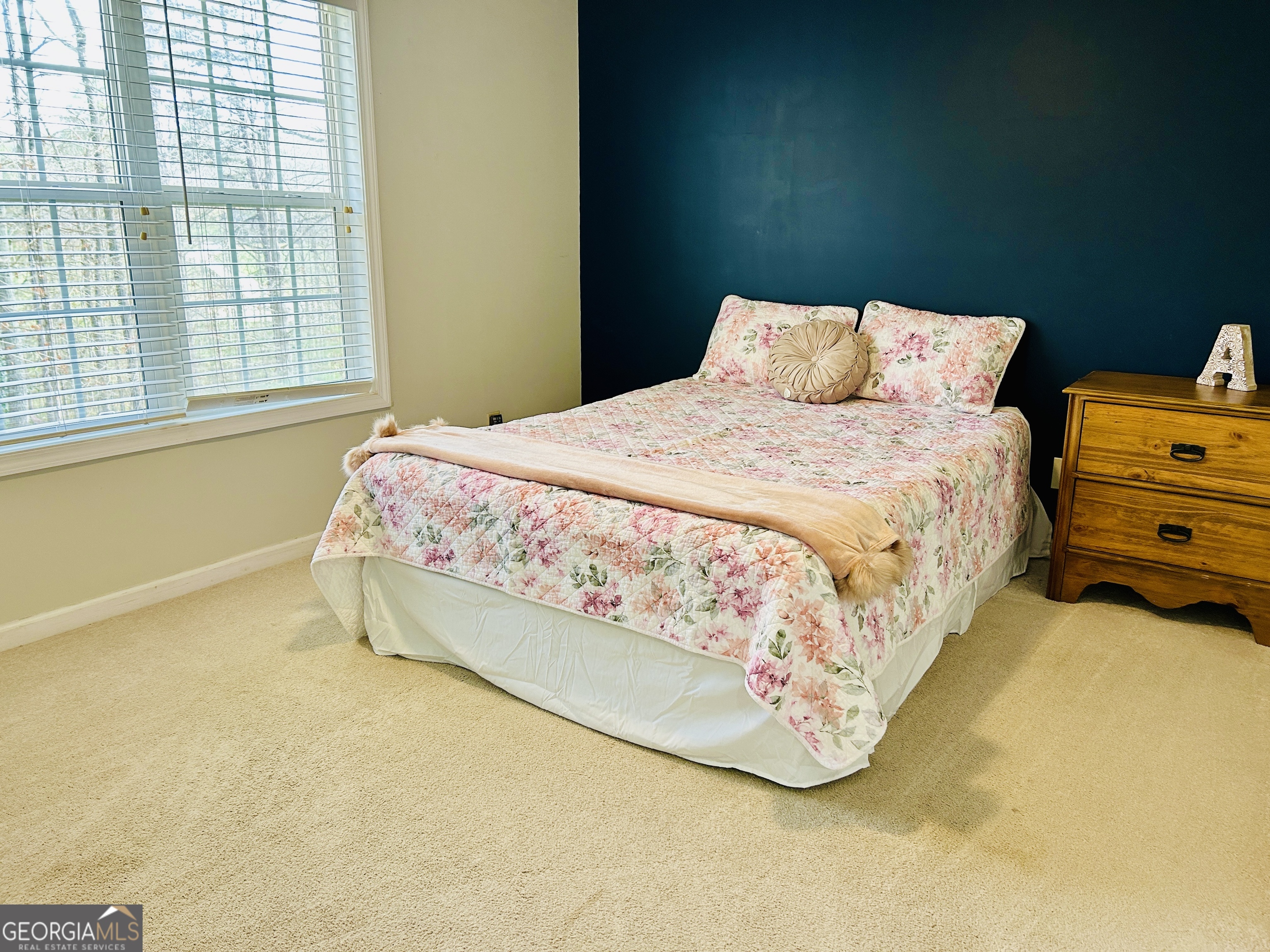 129 Rockwind Way Demorest, GA 30535 - Photo 31 of 45 a bed sitting in a bedroom next to a window