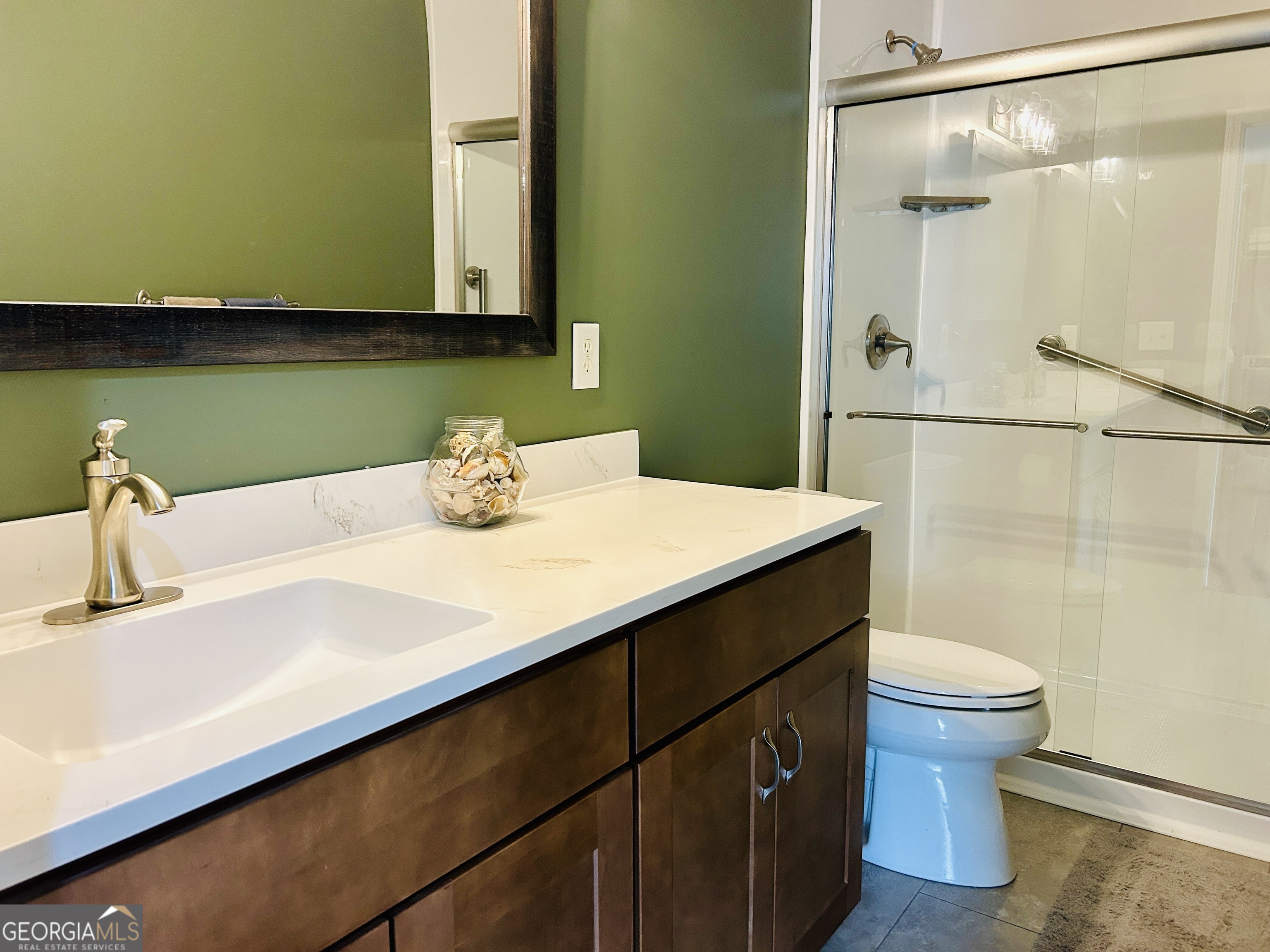 129 Rockwind Way Demorest, GA 30535 - Photo 34 of 45 a bathroom with a sink and a mirror