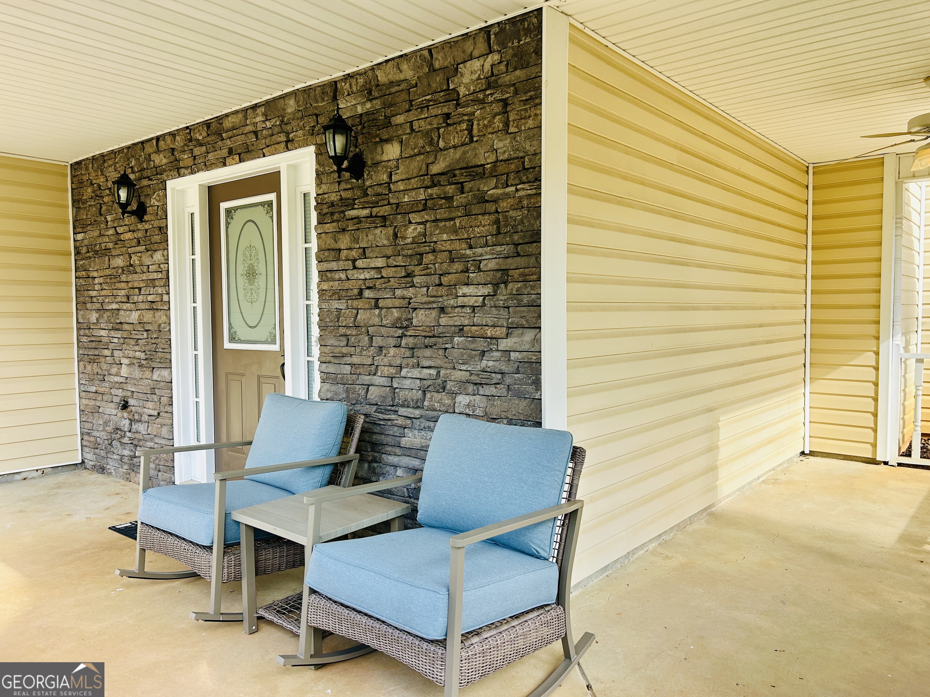 129 Rockwind Way Demorest, GA 30535 - Photo 5 of 45 a blue bench sitting in front of a house