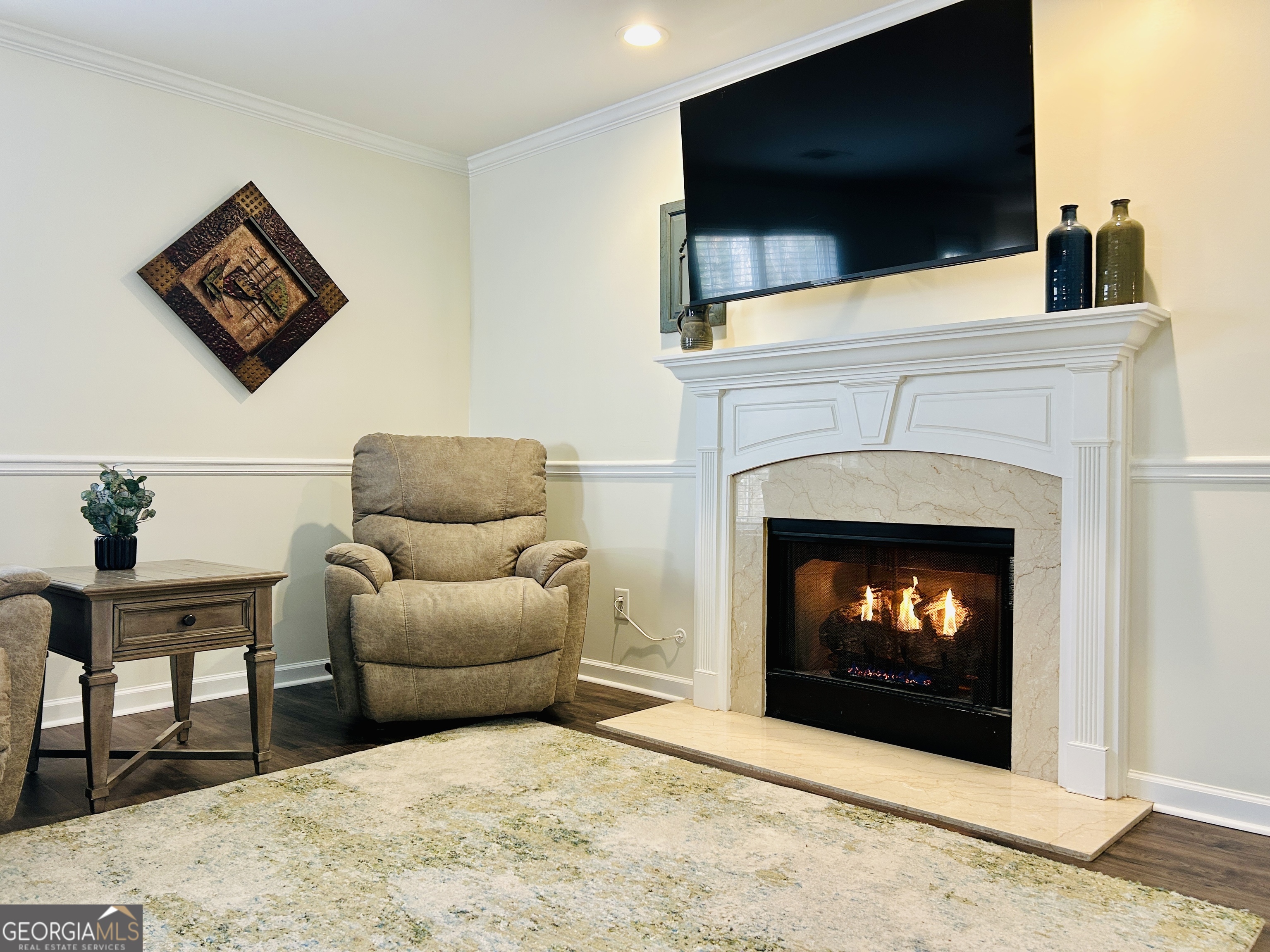 129 Rockwind Way Demorest, GA 30535 - Photo 7 of 45 a living room with a fireplace a flat screen tv and a fireplace