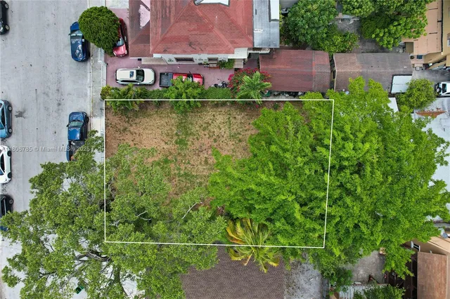 an aerial view of house with yard swimming pool and outdoor seating