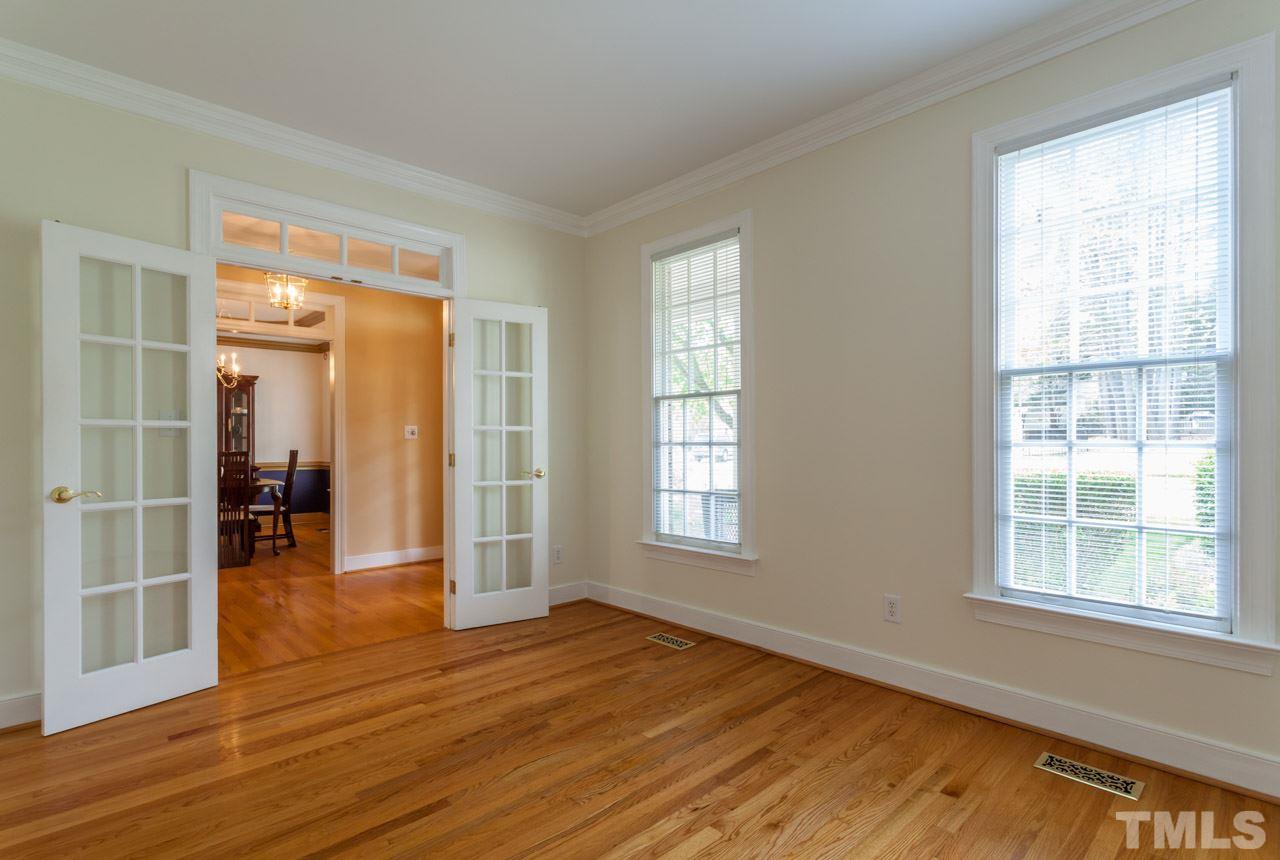 2408 Wertherson Lane Raleigh, NC 27613 - Photo 3 of 25 a view of empty room with wooden floor and fan