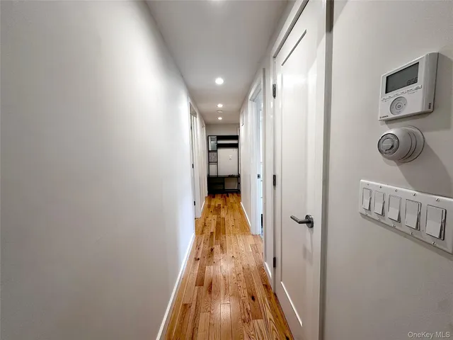a view of a house with a tree in the background