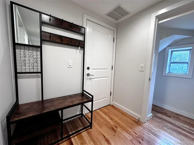 a view of a backyard with sitting area