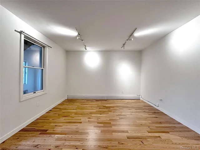 a large kitchen with stainless steel appliances a refrigerator and a stove top oven