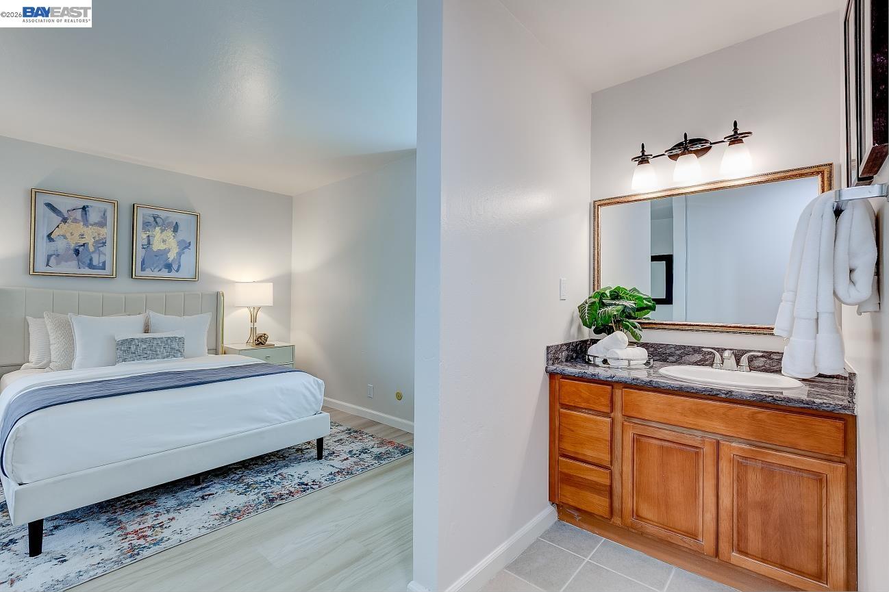 9005 Alcosta Boulevard, Unit 199 San Ramon, CA 94583 - Photo 47 of 57 a bedroom with a bed and a sink