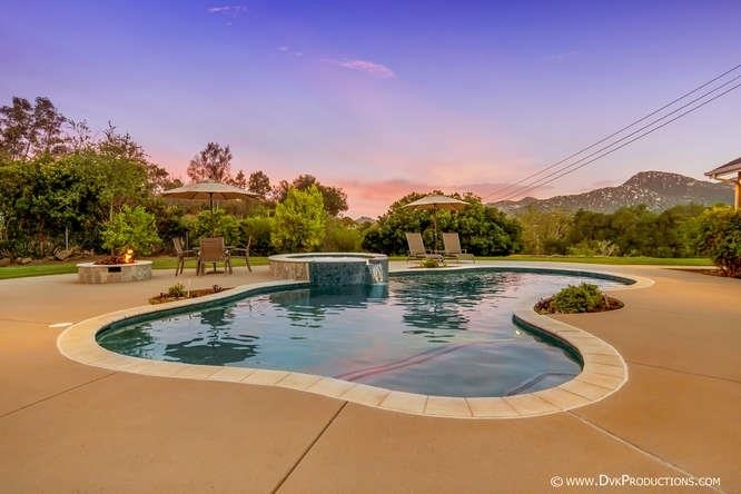 15541 Mussey Grade Road Ramona, CA 92065 - Photo 18 of 25 Gorgeous Backyard with lush landscape, pool, built in barbecue and fire pit.