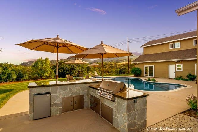 15541 Mussey Grade Road Ramona, CA 92065 - Photo 19 of 25 Gorgeous Backyard with lush landscape, pool, built in barbecue and fire pit.