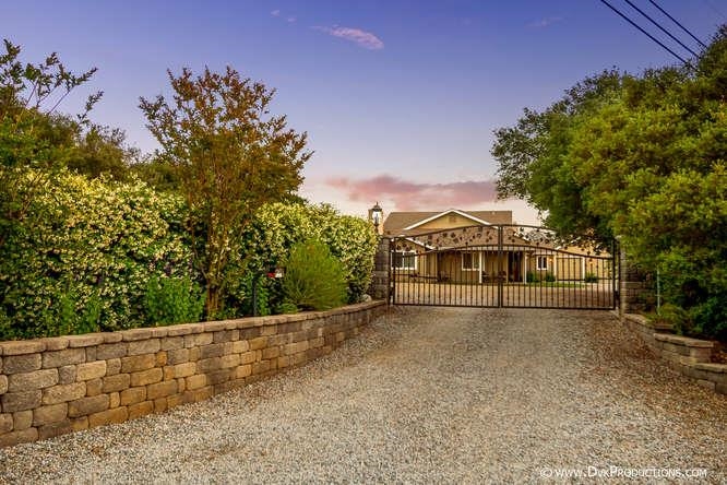 15541 Mussey Grade Road Ramona, CA 92065 - Photo 25 of 25 Beautiful lush landscaping, and wrought iron gate.