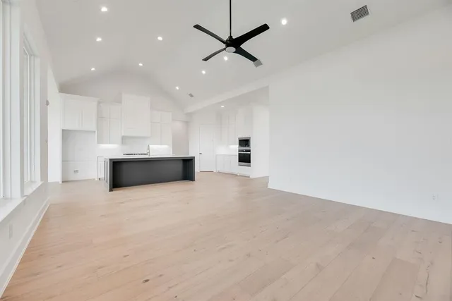 a view of a kitchen with a sink and a stove top oven