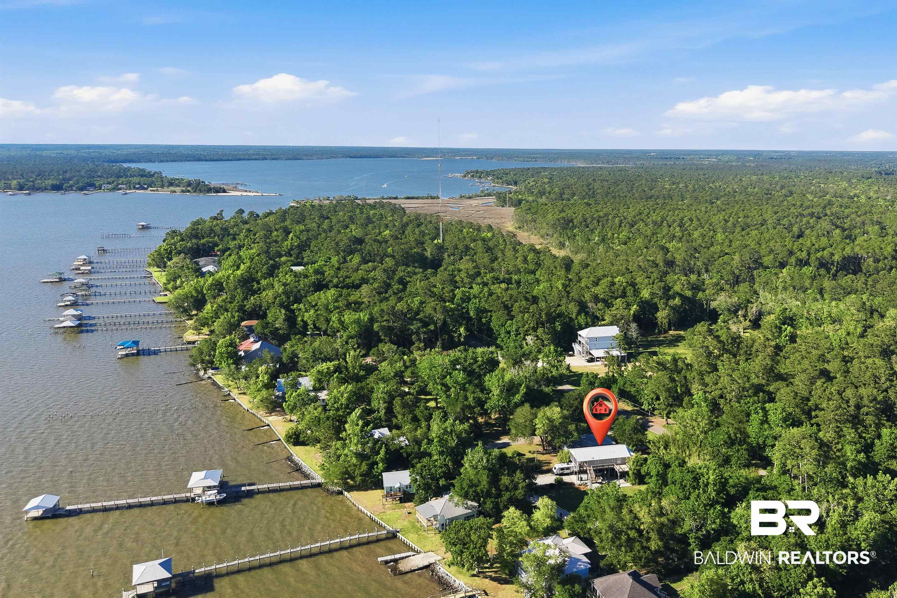 9624 North Bay Street Foley, AL 36535 - Photo 56 of 59 Waterfront property featuring a private boat dock, surrounded by mature trees and expansive water
