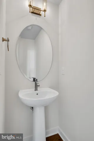 a bathroom with a sink a mirror and vanity