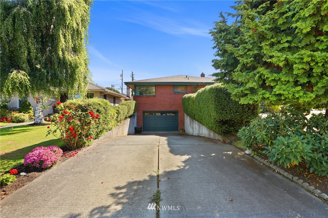831 Rucker Avenue Everett, WA 98201 - Photo 2 of 40 a front view of a house with a yard and fountain
