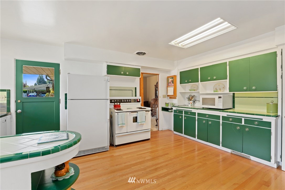 831 Rucker Avenue Everett, WA 98201 - Photo 11 of 40 a kitchen with a sink and cabinets