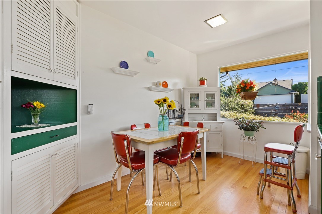 831 Rucker Avenue Everett, WA 98201 - Photo 14 of 40 a view of a dining room with furniture and a potted plant