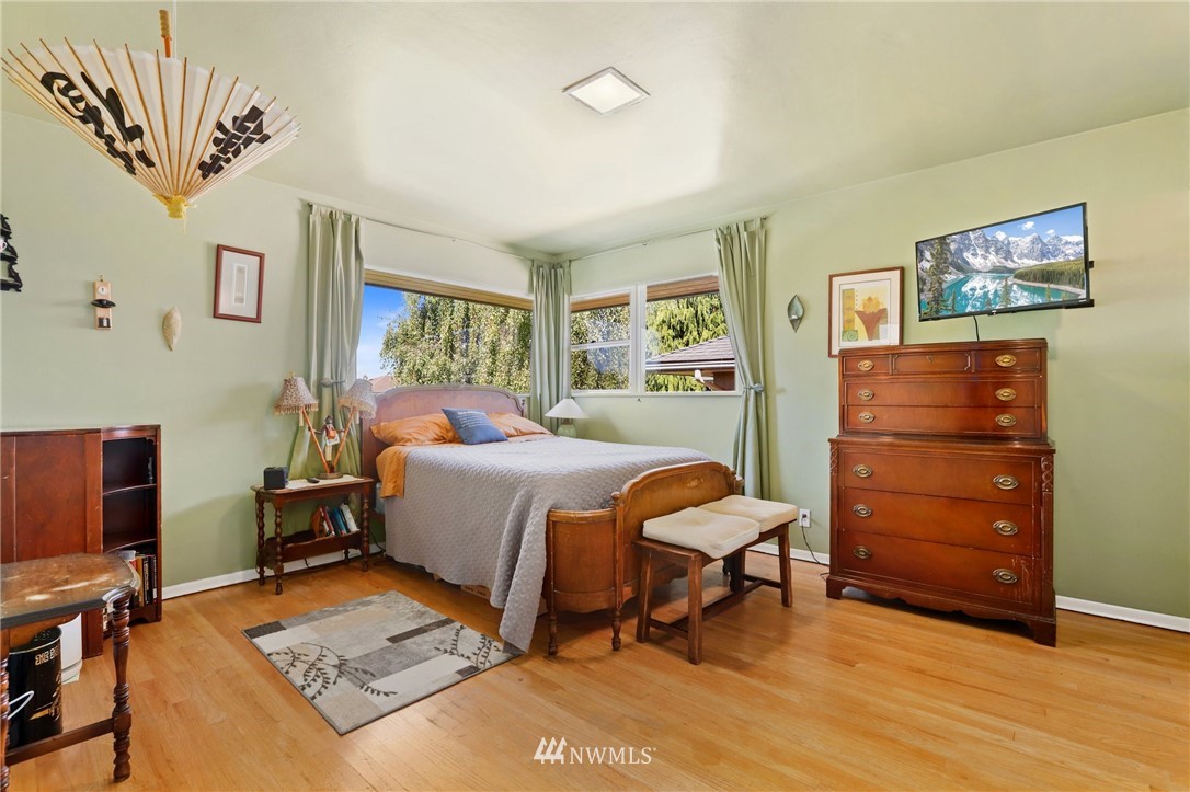 831 Rucker Avenue Everett, WA 98201 - Photo 19 of 40 a bedroom with a bed and furniture