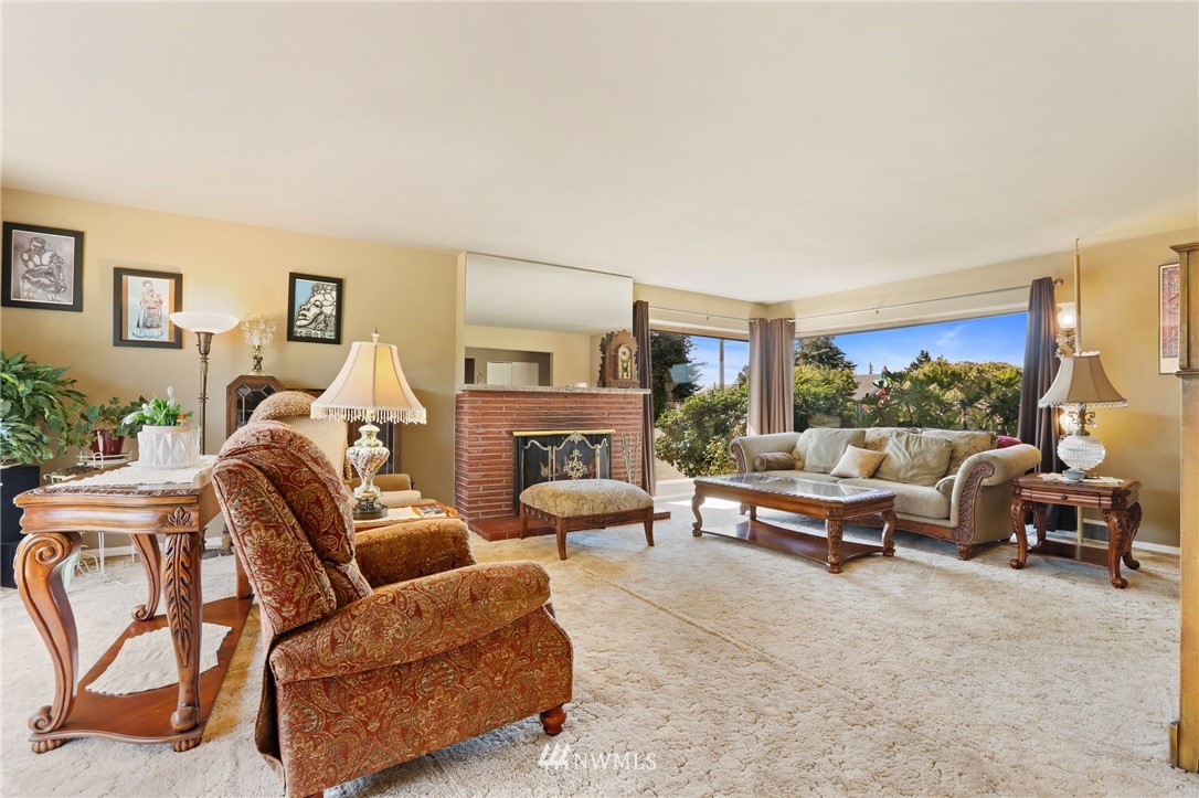 831 Rucker Avenue Everett, WA 98201 - Photo 4 of 40 a living room with furniture kitchen view and a large window
