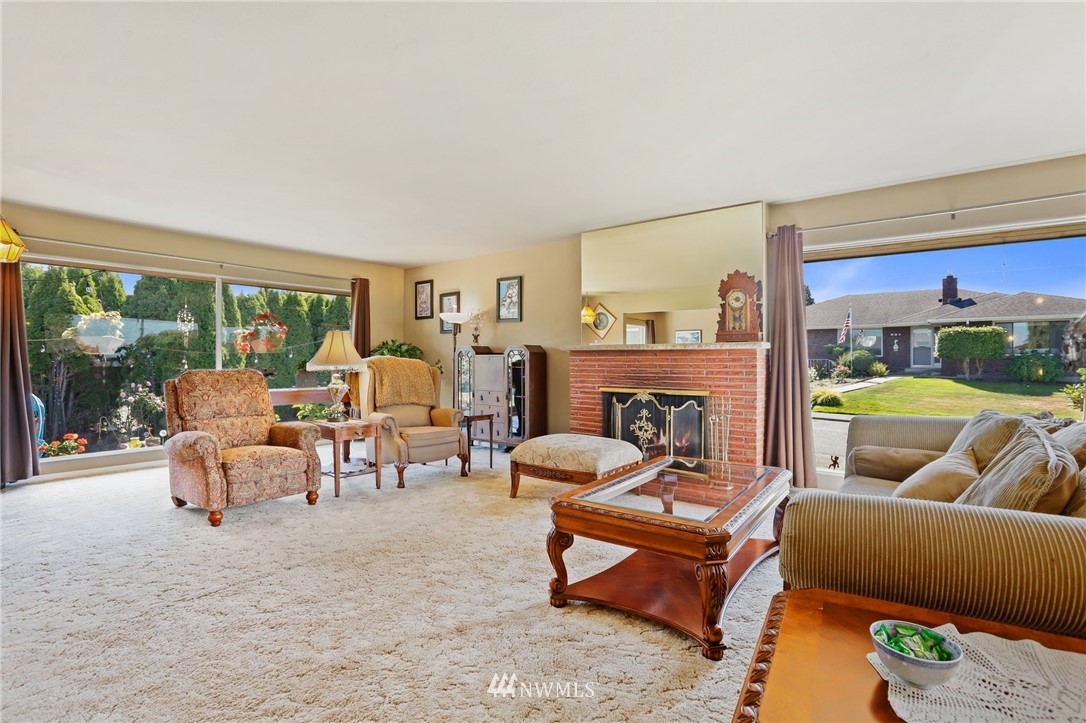 831 Rucker Avenue Everett, WA 98201 - Photo 5 of 40 a living room with furniture and a large window