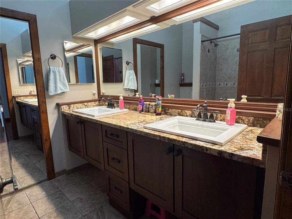 120 East Bahama Road Winter Springs, FL 32708 - Photo 17 of 37 a bathroom with a double vanity sink and a mirror