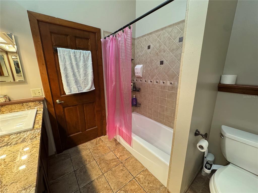 120 East Bahama Road Winter Springs, FL 32708 - Photo 18 of 37 a bathroom with a granite countertop shower a toilet and a sink