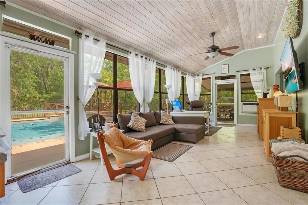120 East Bahama Road Winter Springs, FL 32708 - Photo 22 of 37 a living room with furniture and large windows