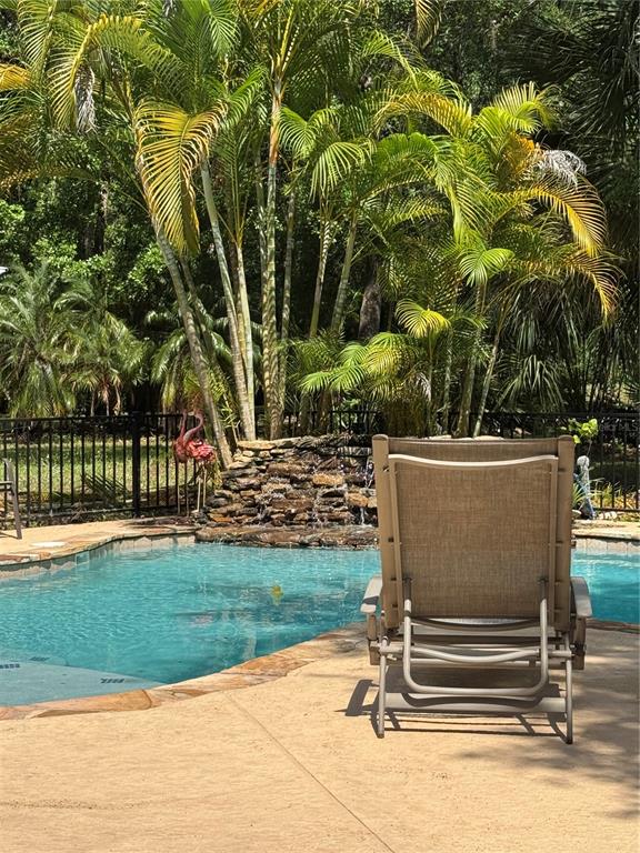 120 East Bahama Road Winter Springs, FL 32708 - Photo 23 of 37 a view of backyard with swimming pool and outdoor seating