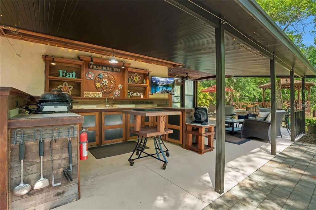 120 East Bahama Road Winter Springs, FL 32708 - Photo 24 of 37 a view of a chairs and table in the balcony