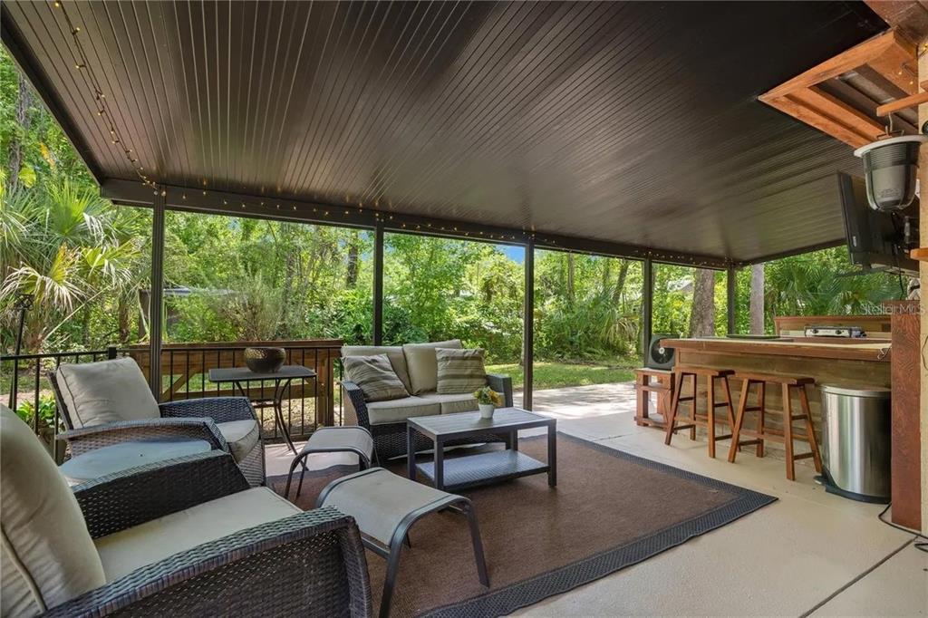 120 East Bahama Road Winter Springs, FL 32708 - Photo 25 of 37 an outdoor living and dining space with furniture