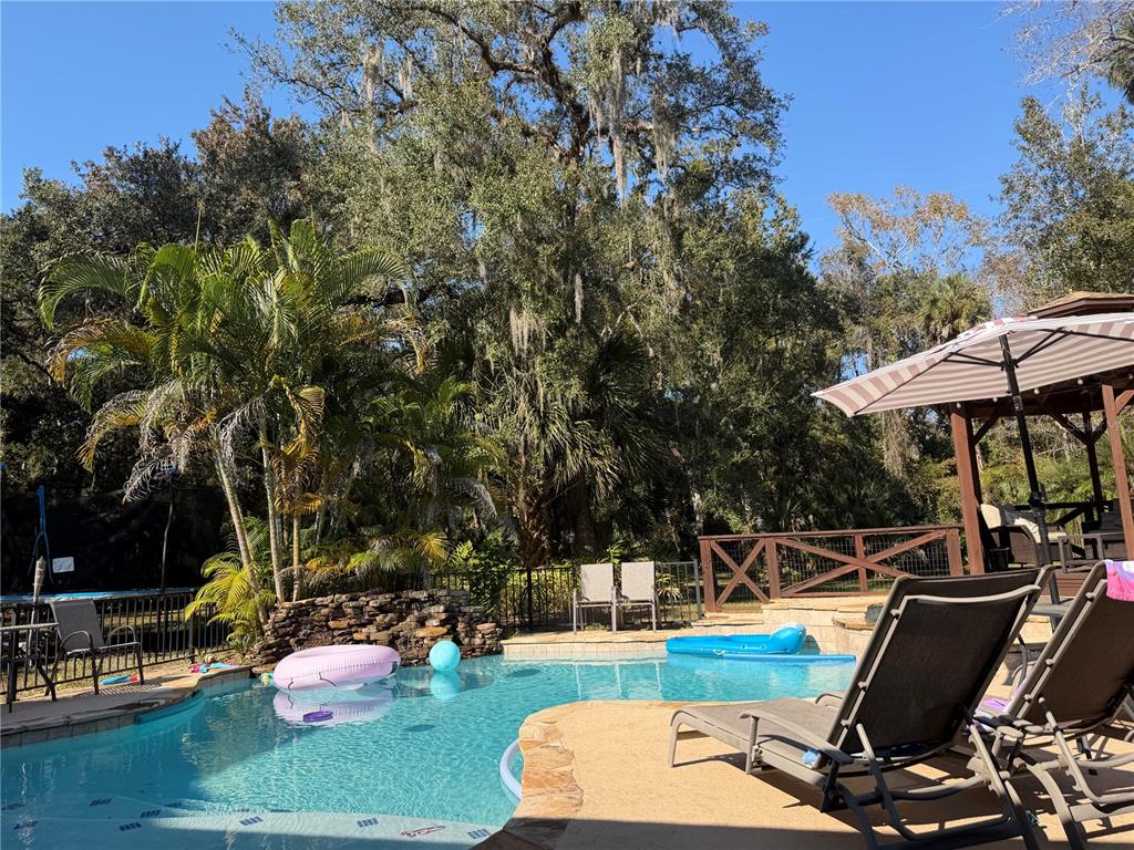 120 East Bahama Road Winter Springs, FL 32708 - Photo 28 of 37 a view of a two chairs and table in the patio