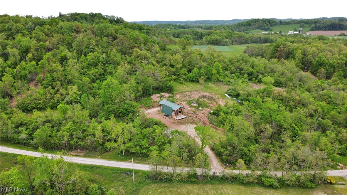 19853 Kansas Road Quaker City, OH 43773 - Photo 5 of 9 Aerial view of a heavily wooded area