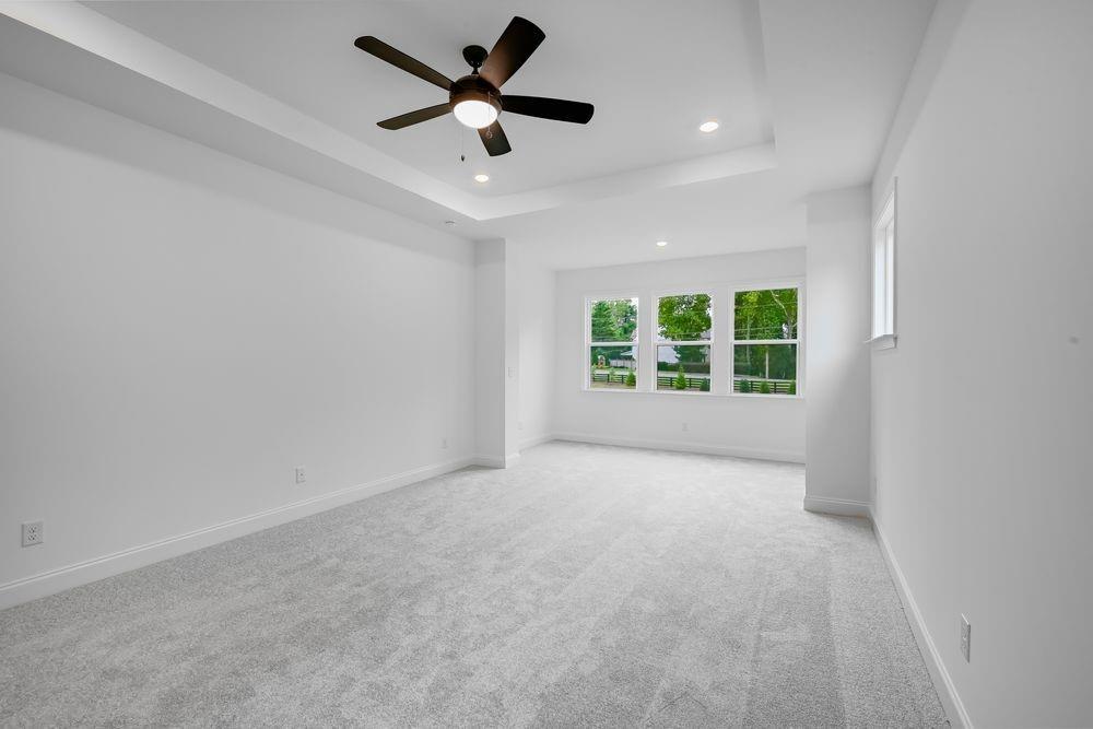 2311 Ellie Way Kennesaw, GA 30152 - Photo 11 of 35 an empty room with windows and ceiling fan
