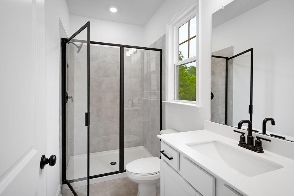 2311 Ellie Way Kennesaw, GA 30152 - Photo 22 of 35 a bathroom with a sink toilet and shower