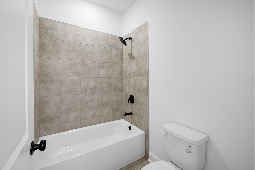 2311 Ellie Way Kennesaw, GA 30152 - Photo 23 of 35 a bathroom with a bathtub and shower