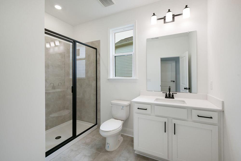 2311 Ellie Way Kennesaw, GA 30152 - Photo 25 of 35 a bathroom with a sink a toilet and shower