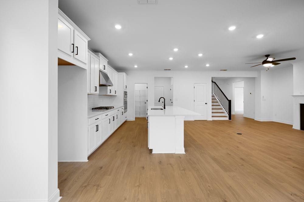 2311 Ellie Way Kennesaw, GA 30152 - Photo 6 of 35 a view of kitchen with furniture and wooden floor