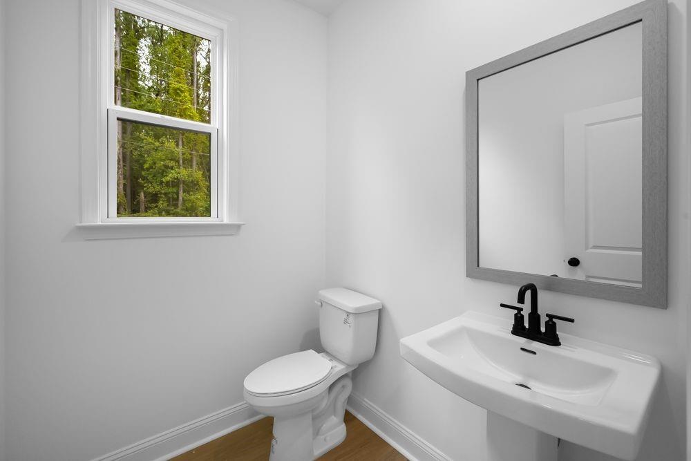 2311 Ellie Way Kennesaw, GA 30152 - Photo 10 of 35 a bathroom with a sink a toilet and a mirror
