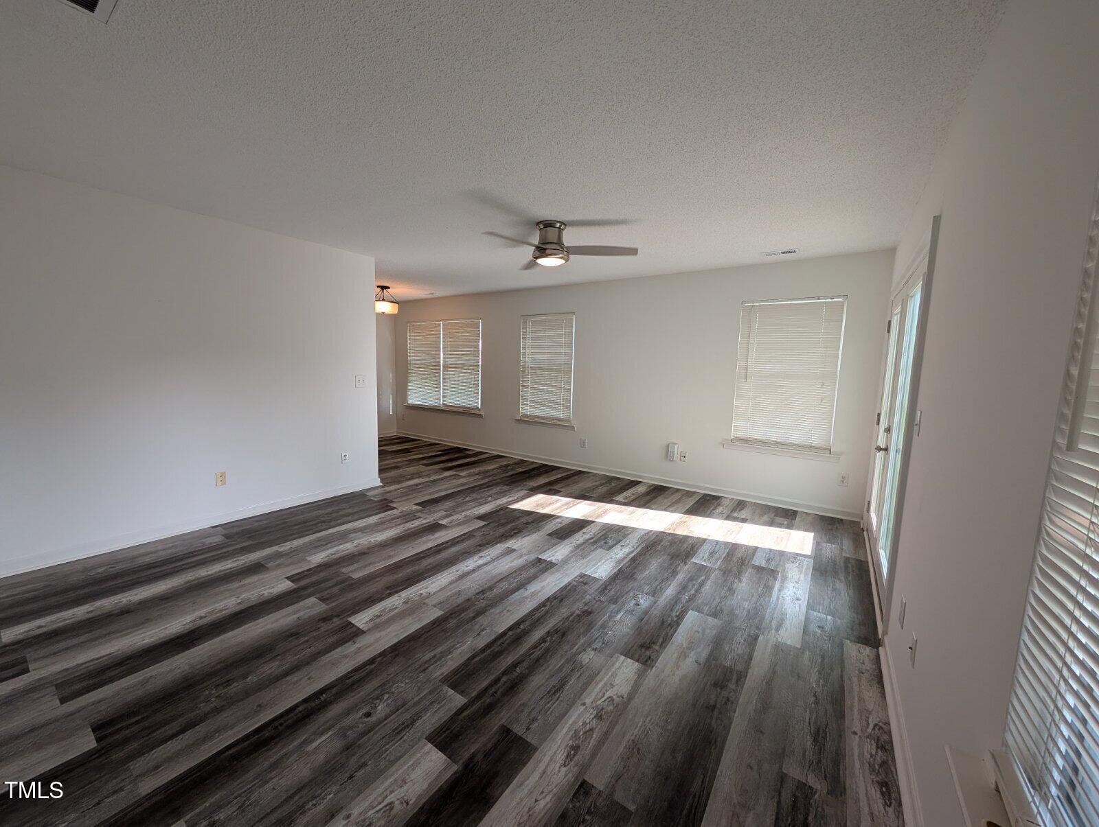 7528 Argent Valley Drive Raleigh, NC 27616 - Photo 11 of 47 wooden floor in an empty room