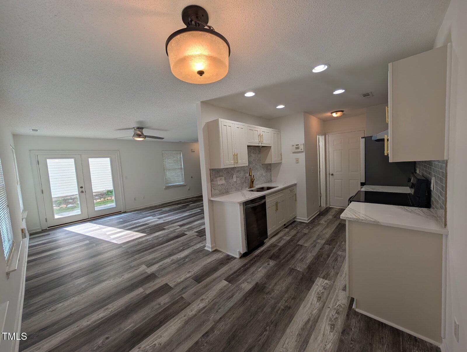 7528 Argent Valley Drive Raleigh, NC 27616 - Photo 15 of 47 a kitchen with stove cabinets and refrigerator