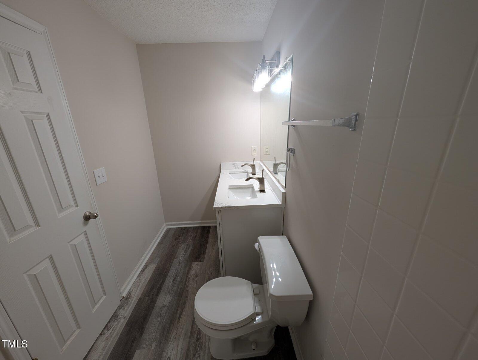 7528 Argent Valley Drive Raleigh, NC 27616 - Photo 22 of 47 a bathroom with a sink and a toilet