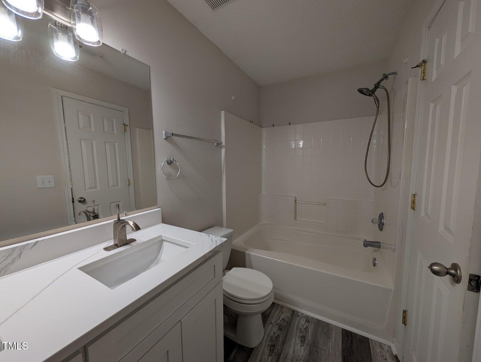 7528 Argent Valley Drive Raleigh, NC 27616 - Photo 36 of 47 a bathroom with a sink toilet tub and shower
