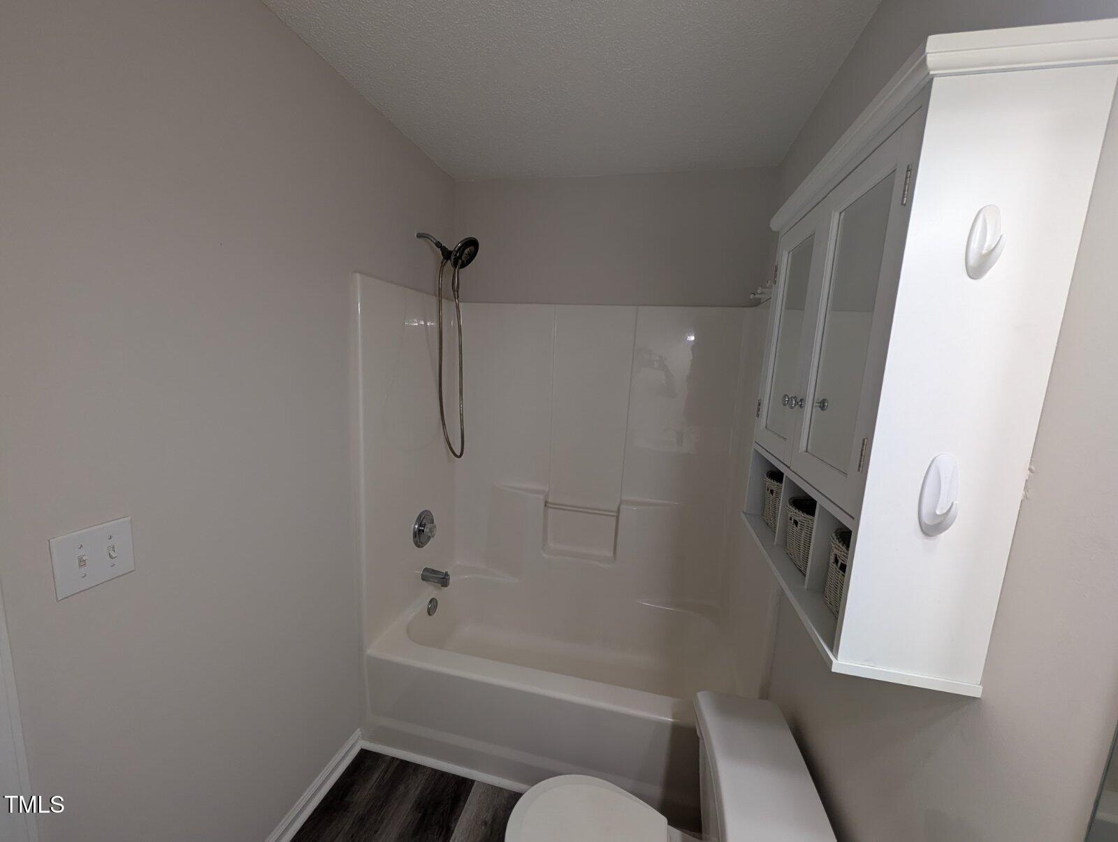 7528 Argent Valley Drive Raleigh, NC 27616 - Photo 41 of 47 a bathroom with a tub and a shower