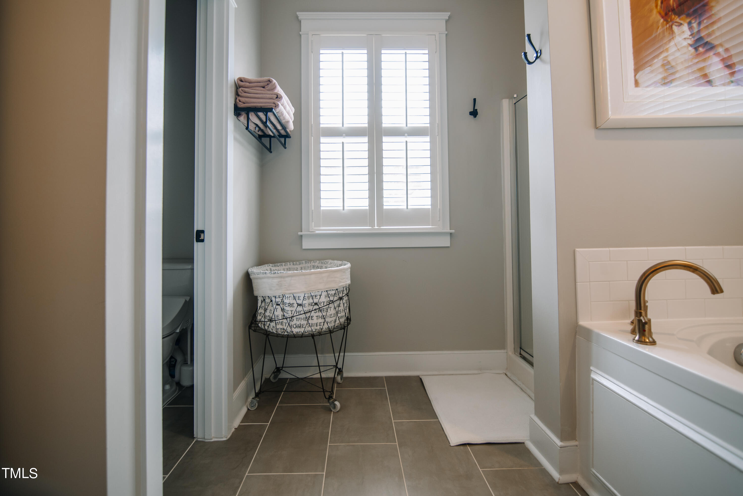 2222 Dunlin Lane Raleigh, NC 27614 - Photo 18 of 35 Spa-like bath features separate shower, water closet, and soaking tub.