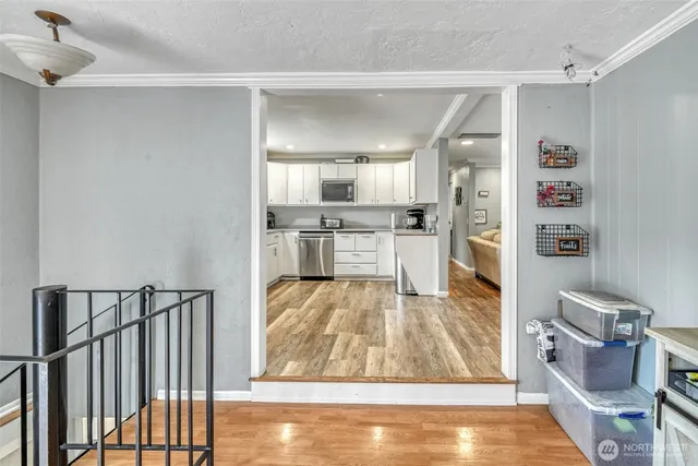 a view of a livingroom with furniture window and wooden floor