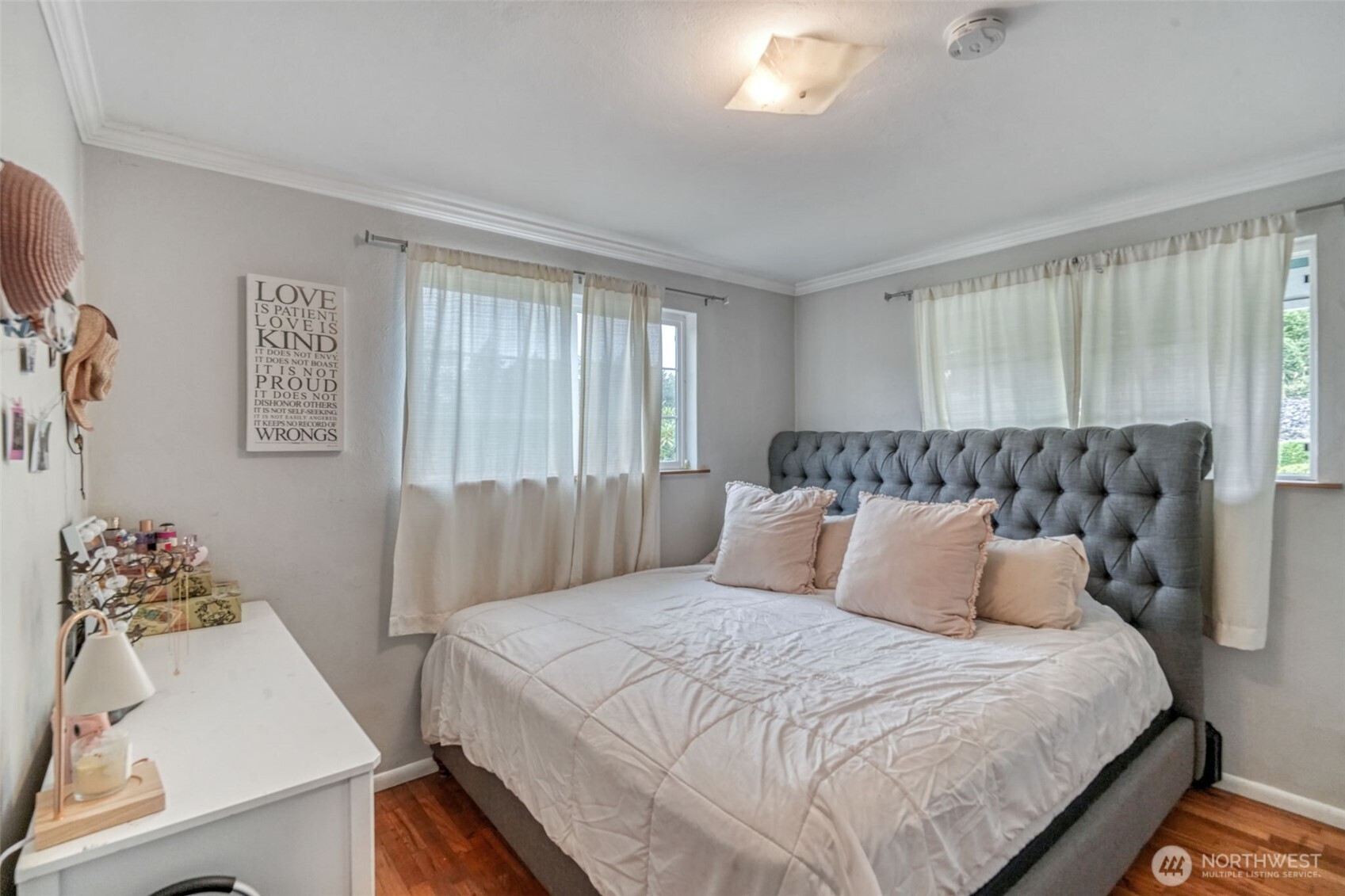 523 Haywire Road Winlock, WA 98596 - Photo 14 of 40 a bedroom with a bed and wooden floor