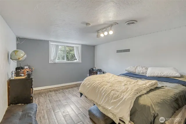 a bathroom with a sink shower and a mirror