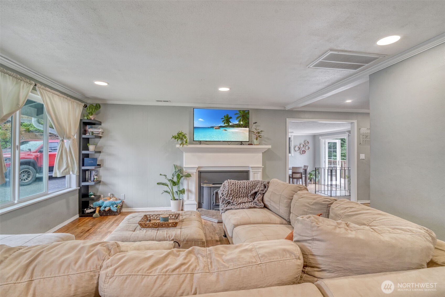 523 Haywire Road Winlock, WA 98596 - Photo 2 of 40 a bedroom with a bed a potted plant on dresser and a window