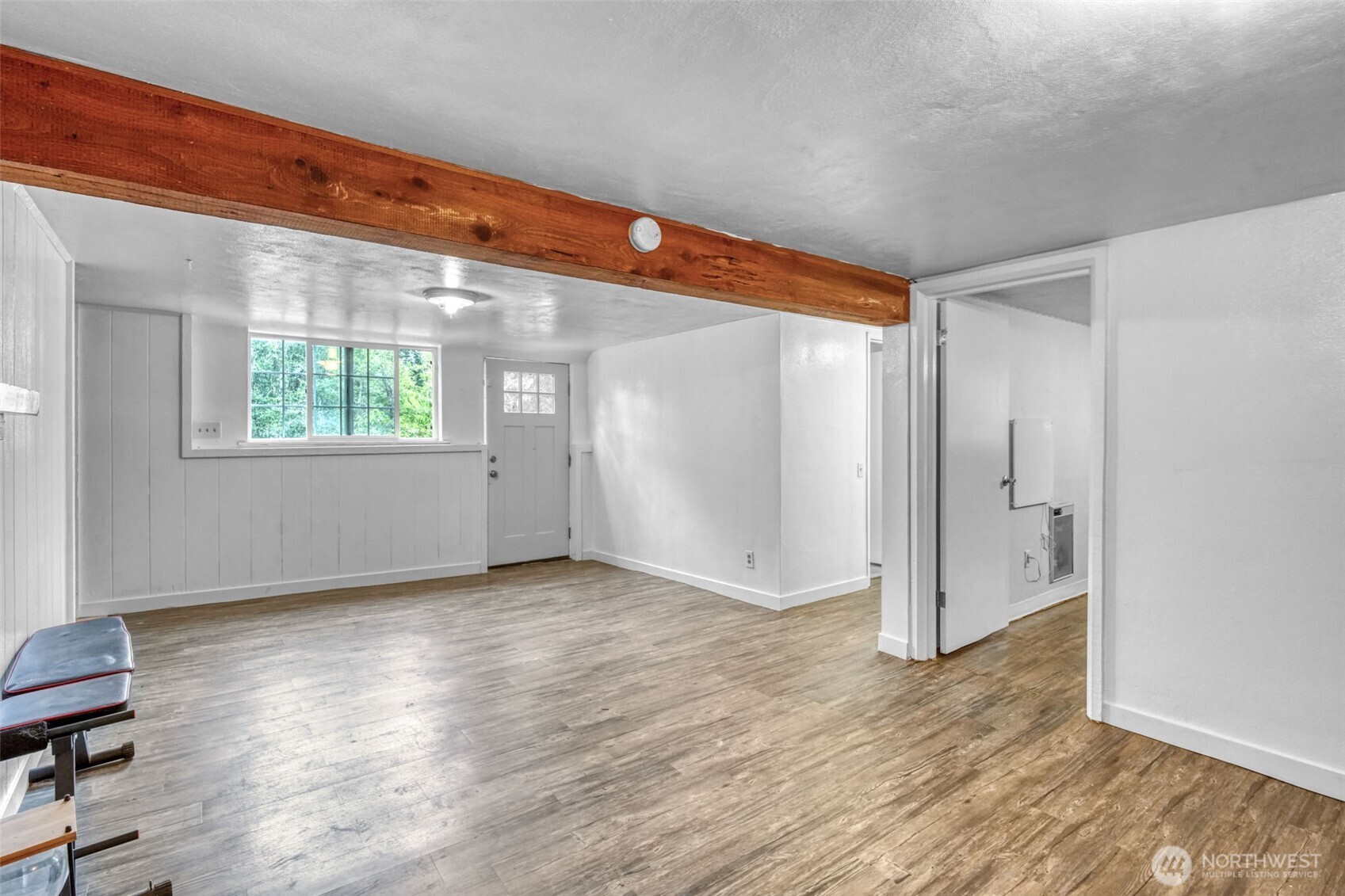 523 Haywire Road Winlock, WA 98596 - Photo 23 of 40 a view of an empty room with wooden floor and a window
