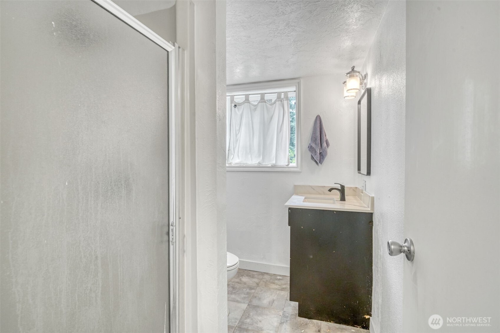 523 Haywire Road Winlock, WA 98596 - Photo 29 of 40 a bathroom with a sink a toilet and mirror