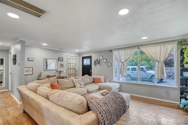 a living room with a couch and a large window